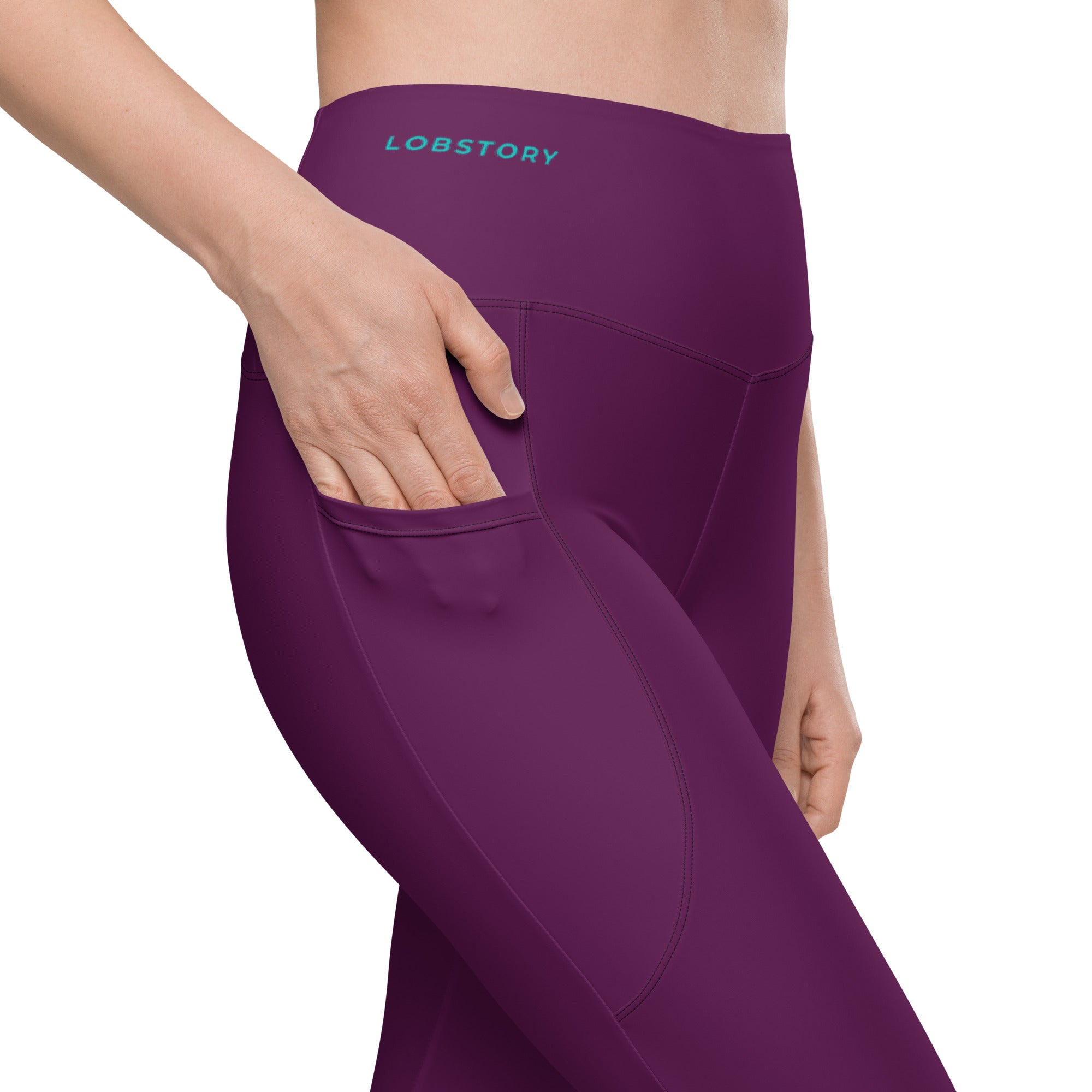 Front view mockup of burgundy ¡VAMOS! Pocket Leggings with teal vertical graphic on the leg. LOBSTORY close up